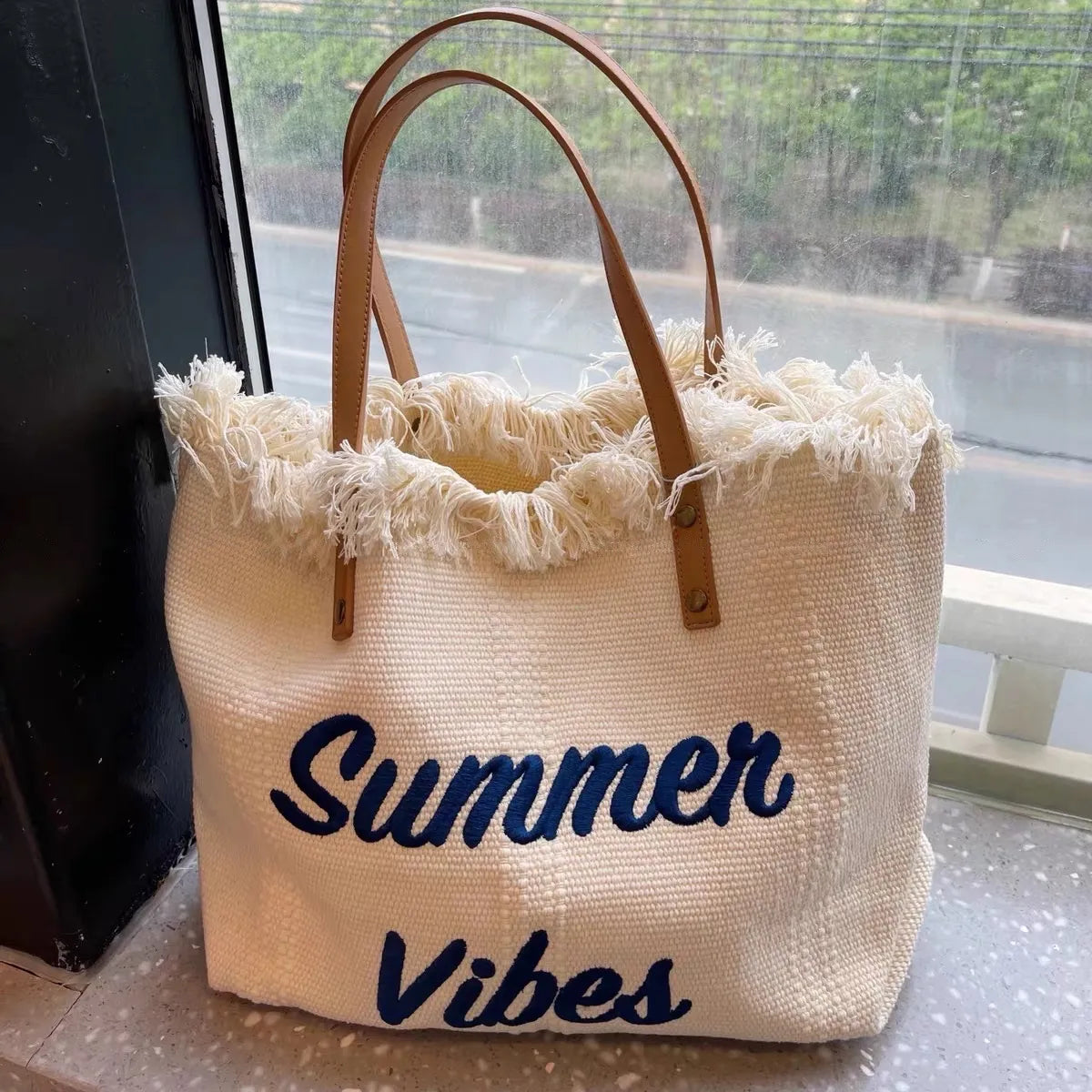 WOVEN CANVAS BAG WITH EMBROIDERED FRONT