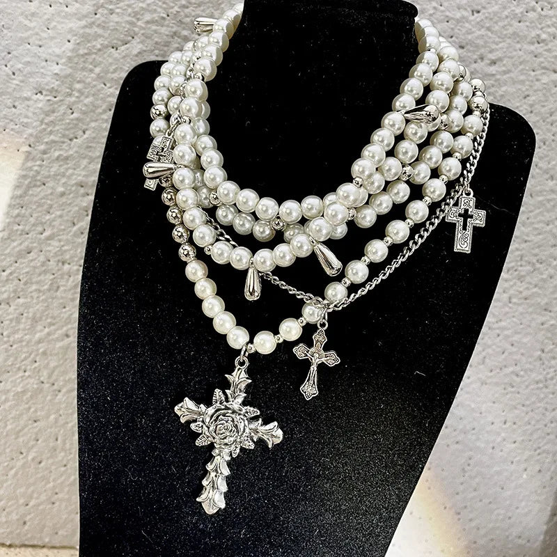 Layered pearl beaded necklace with decorative cross