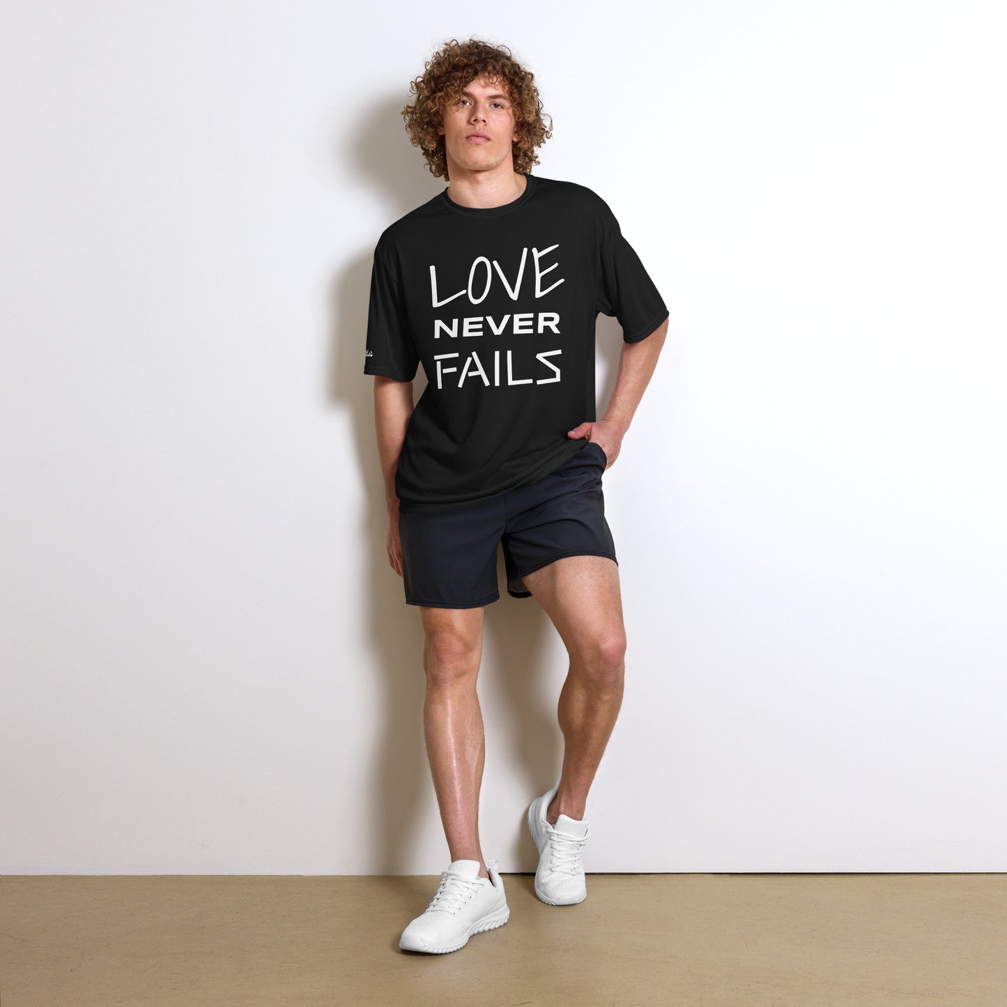 LOVE NEVER FAILS- Unisex performance crew neck t-shirt
